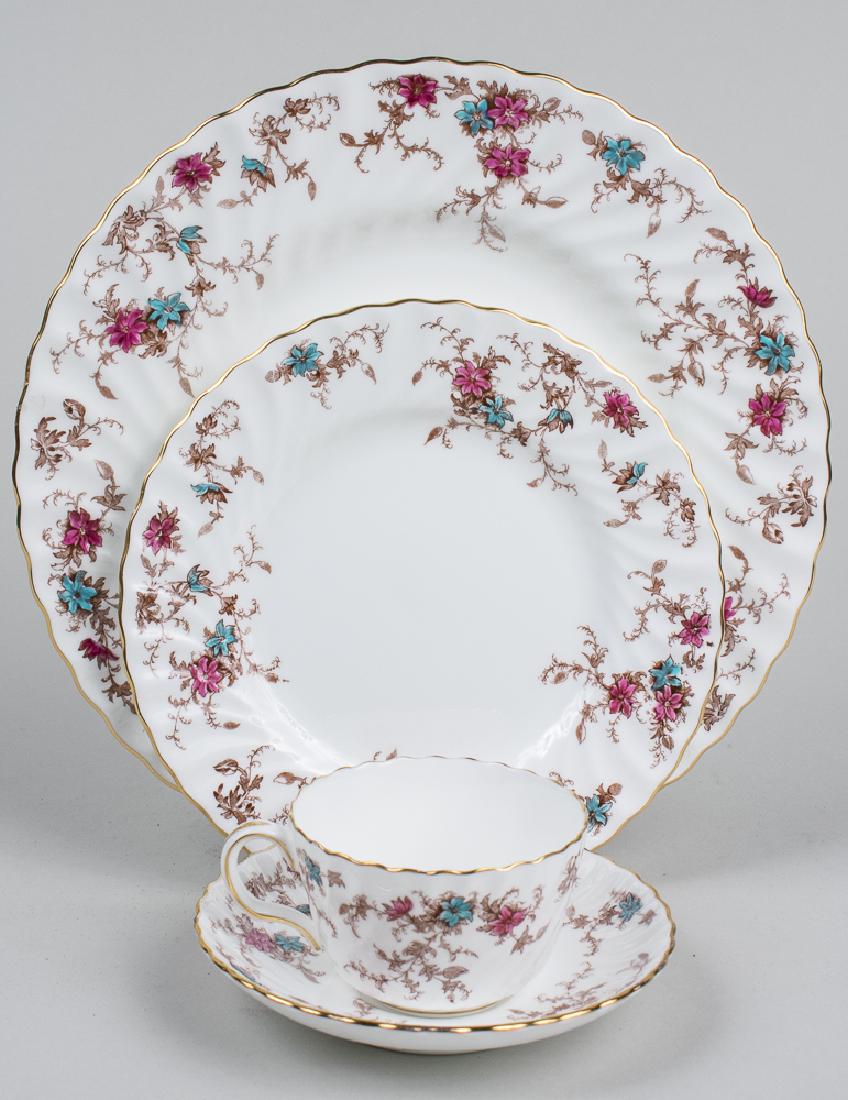 Minton Porcelain Dinner Service: Approximately seventy six pieces, Ancestral pattern, comprising three graduated sized platters, soup tureen, thirteen dinner plates, fourteen salad plates, twelve cream soup bowls, twelve underplates,