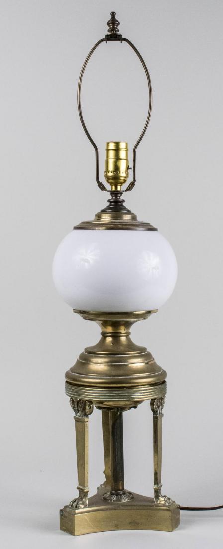 Neoclassical Style Lamp: Single light lamp with white globular shade. Base, height 18 inches. Notice to bidders: Condition reports and additional photographs are provided by request as a courtesy to our clients, as such any c