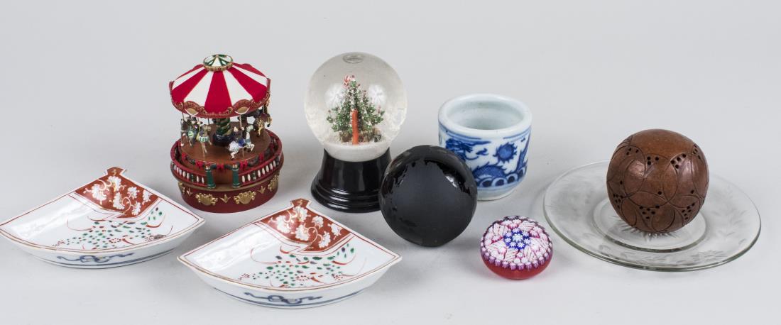 Group of Table Decorations: Including a carousel, a snow globe, two paperweights, two fan form dishes, etc. Various sizes. Notice to bidders: Condition reports and additional photographs are provided by request as a courtesy to 