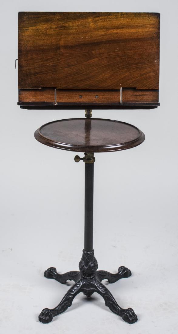 John Carter Victorian Literary Machine: Early 19th century, reading stand, metal label on the back. Height 42 inches. Notice to bidders: Condition reports and additional photographs are provided by request as a courtesy to our clients, as s