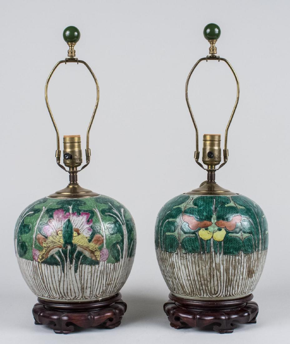 Pair of Chinese Porcelain Jar Lamps: Single light lamps, ovoid porcelain bases with floral decoration. Base, height 10 inches. Notice to bidders: Condition reports and additional photographs are provided by request as a courtesy to our c