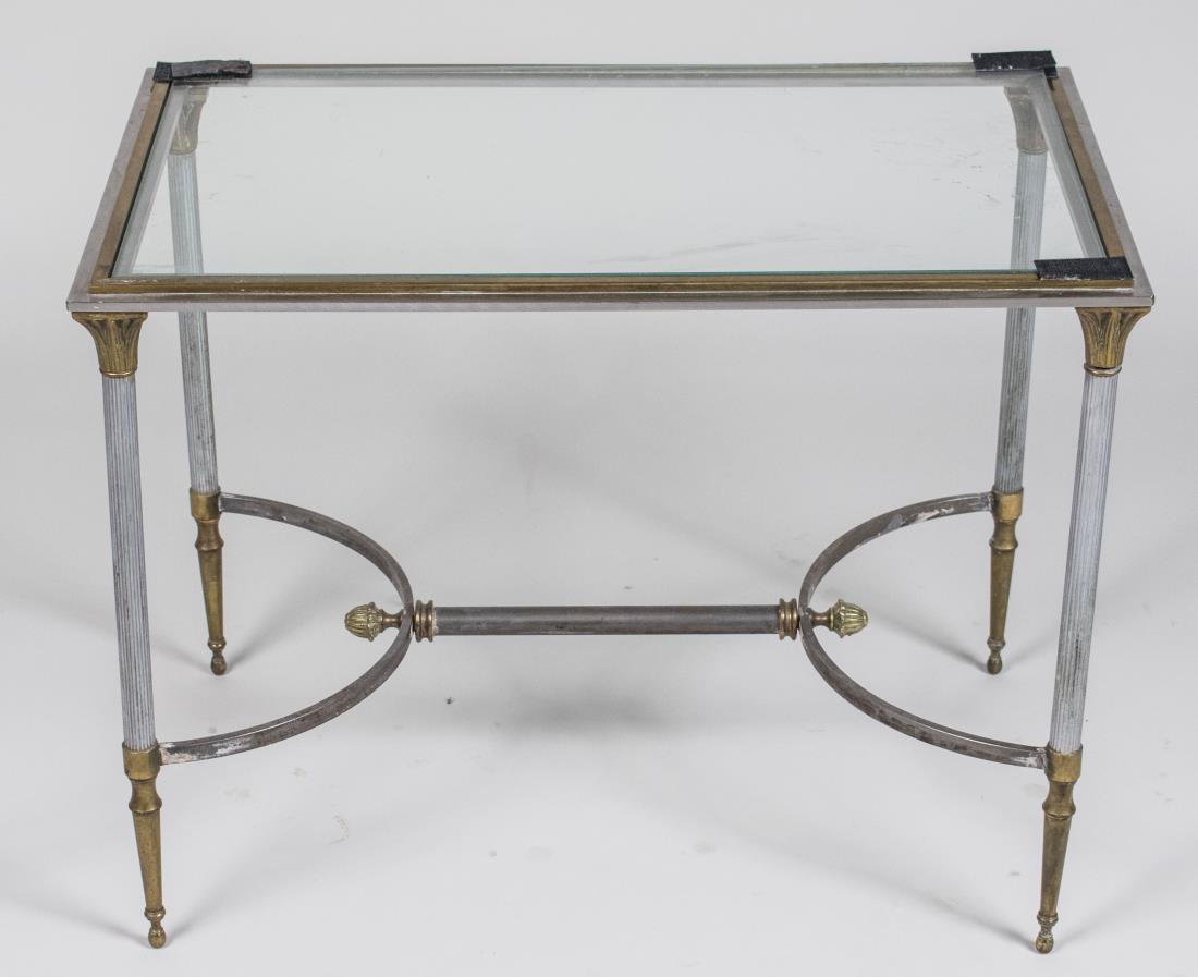 Glass Top Side Table: Rectangular glass top on a brass and brushed metal neoclassical style base. Height 19 inches, width 24 inches, depth 15 inches. Notice to bidders: Condition reports and additional photographs are prov