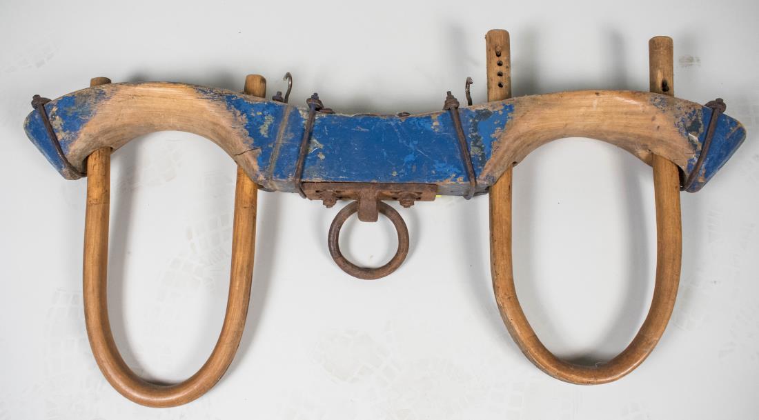 Ox Yoke: Polychrome painted decoration. Height 26 inches, width 52 inches. Notice to bidders: Condition reports and additional photographs are provided by request as a courtesy to our clients, as such any cond