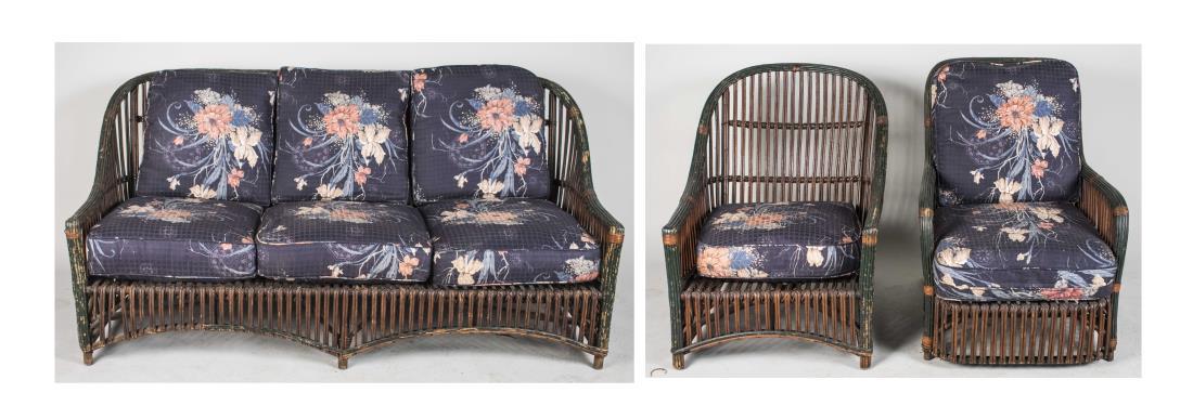 Three Piece Antique Wicker Furniture Suite: Including a three cushion seat sofa, and two similar matching armchairs, floral print upholstery. Sofa, length 64 inches. Notice to bidders: Condition reports and additional photographs are provided b