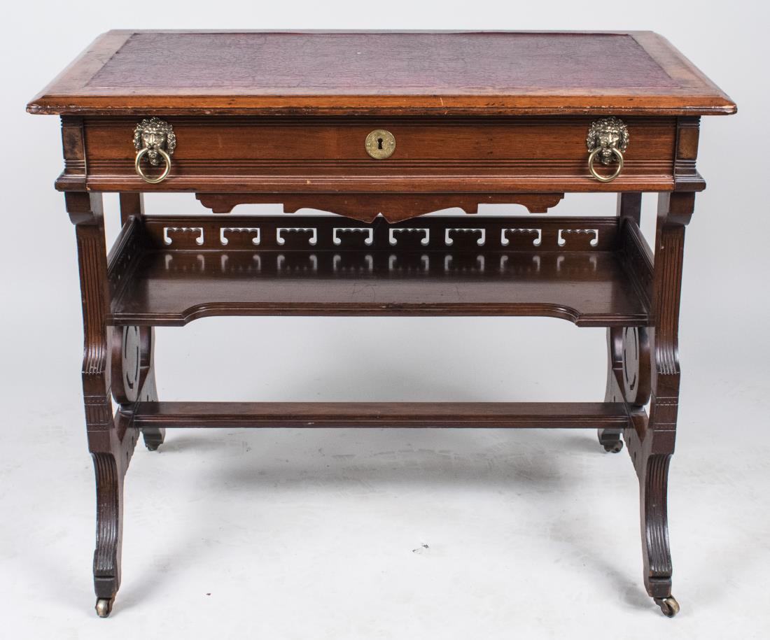 Leather Top Table: Rectangular top on a trestle base with lower shelf. Height 30 inches, width 36 inches, depth 21 inches. Notice to bidders: Condition reports and additional photographs are provided by request as a cou