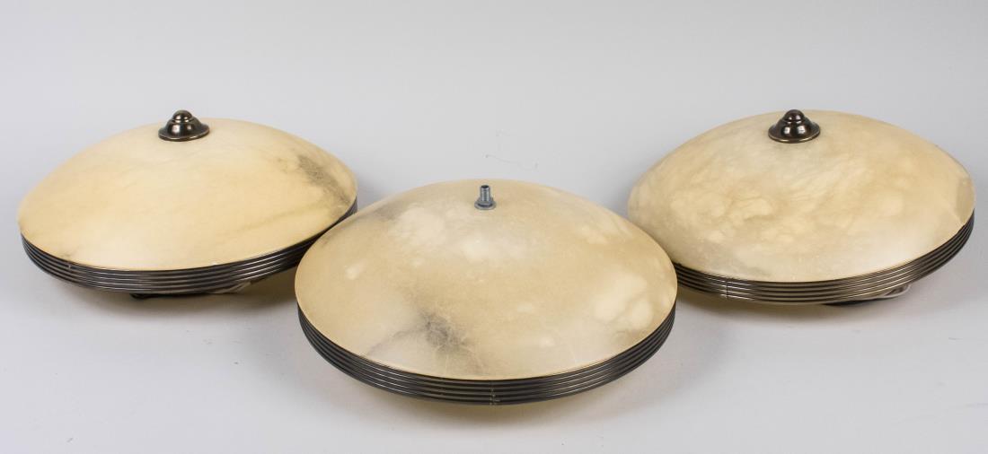 Three Alabaster Ceiling Lights: Inverted dome shaped. Diameter 14 inches. Notice to bidders: Condition reports and additional photographs are provided by request as a courtesy to our clients, as such any condition report is only an 
