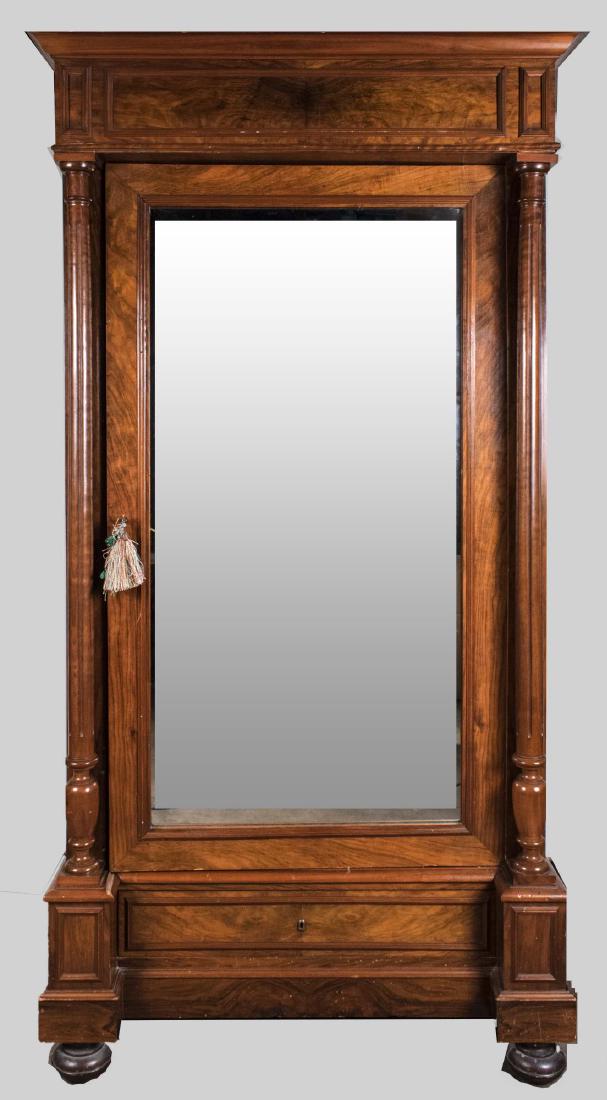 Mahogany MIrrored Door Armoire: Moulded plinth cornice over one mirrored door, flanked by columns with square bases on half bun feet. Height 85 inches, width 44 inches, depth 25 inches. Notice to bidders: Condition reports and addit