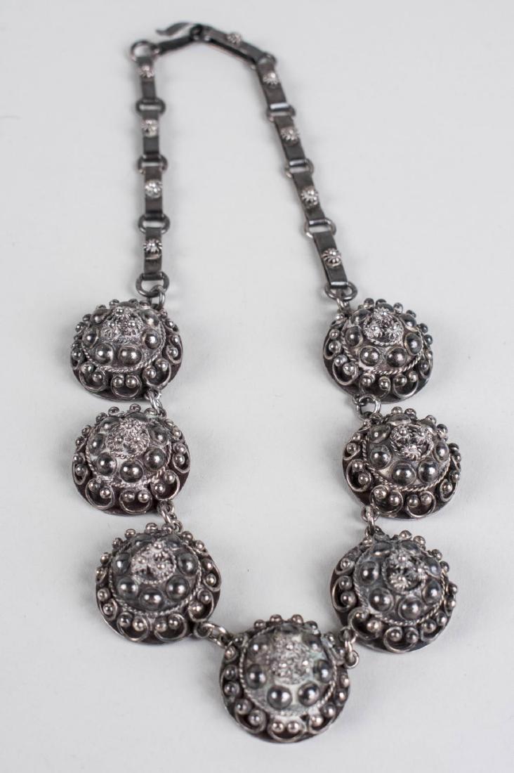 Bekmann Mexican Silver Necklace: Hand made necklace with seven dome shaped discs decorated with twist rope and half balls. Length 17 inches, 92 grams. Notice to bidders: Condition reports and additional photographs are provided by re