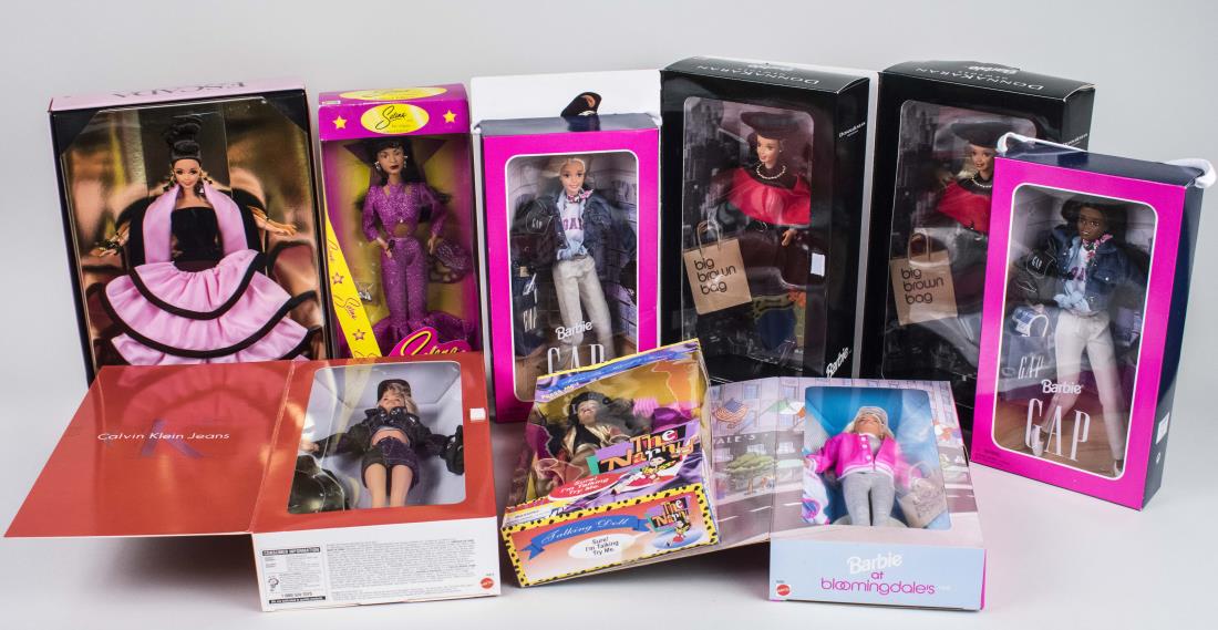 Group of Vintage Barbie Dolls: Eight dolls including the GAP, Bloomingdales, Escada, and Calvin Klein special editions, together with an Enesco music box, a Selena doll, a The Nanny doll, a Corelle doll, and an English collectable