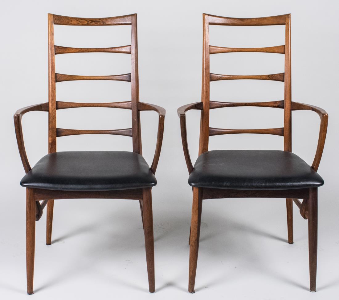 Pair of Niels Koefoed Rosewood Lis Armchairs: For Koefoed Hornslet, marked made in Denmark on seat rail, each with tapered ladder back and black leatherette upholstered seat on round tapered legs. Height 37 1/2 inches, width 21 3/4 inches, depth 