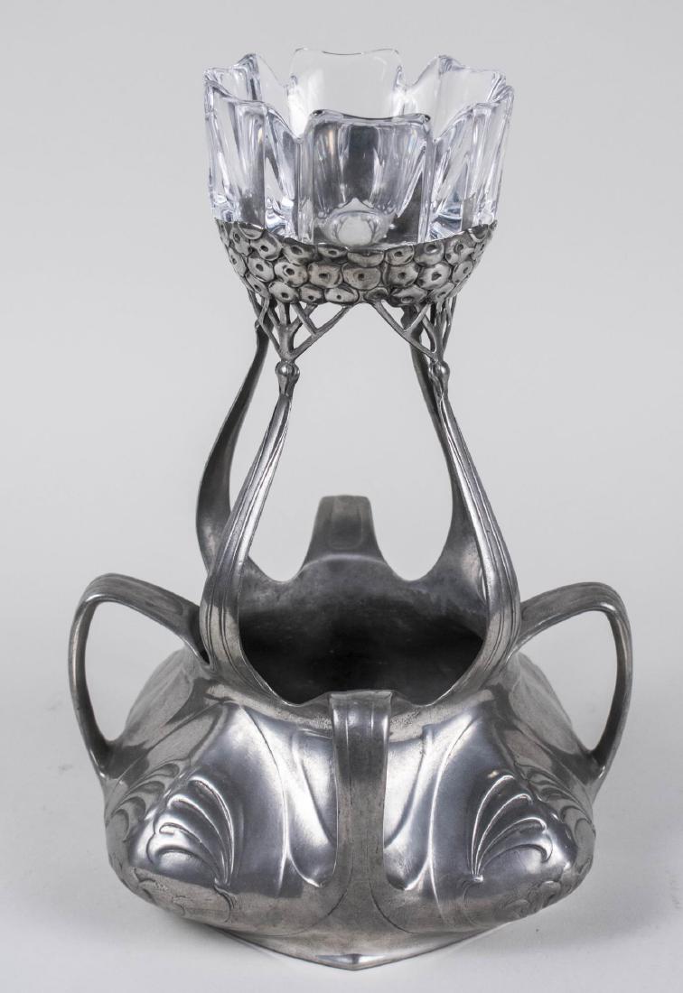 Art Nouveau Pewter Centerpiece / Vase: Floral decoration, signed Osiris, with an associated Orrefors glass dish. Height overall 13 1/2 inches. Notice to bidders: Condition reports and additional photographs are provided by request as a cou