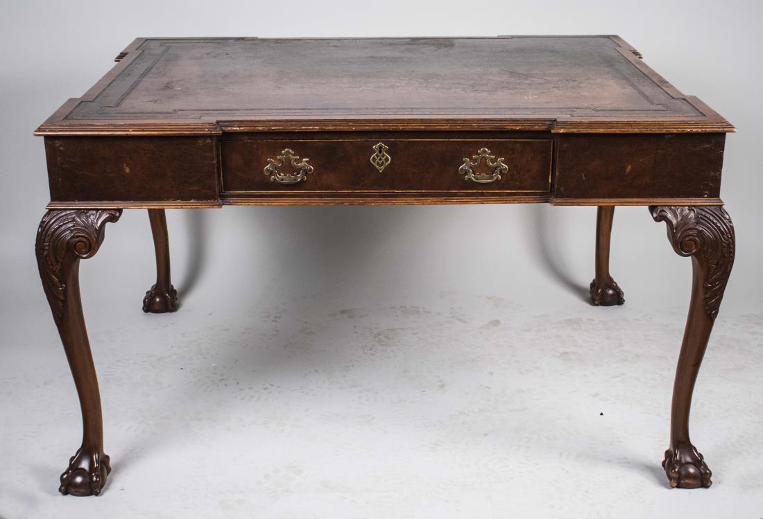 Georgian Style Leather Top Partners Desk: Brown leather inset blockfronted top over a center drawer on each side, carved cabriole legs ending in claw and ball feet. Height 31 1/2 inches, width 54 inches, depth 43 inches. Notice to bidders: Co