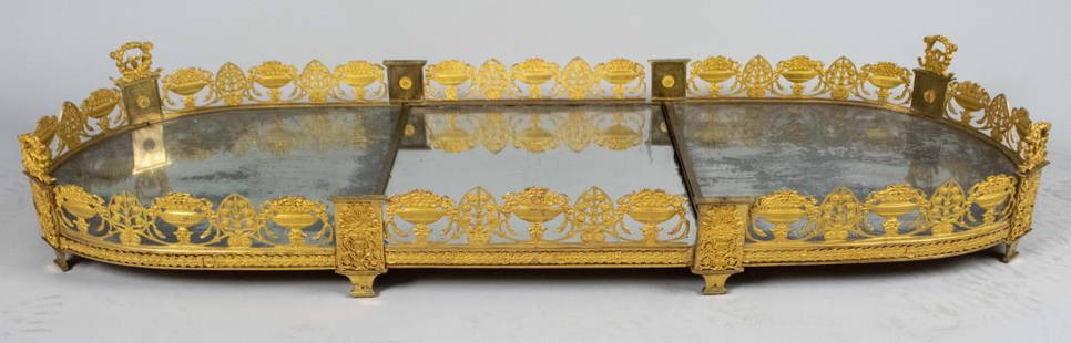 Empire Gilt Bronze Plateau: Circa 1810, three piece set with neoclassical decoration of scrolls, flower filled baskets and urns. Length overall 54 inches. Notice to bidders: Condition reports and additional photographs are provi