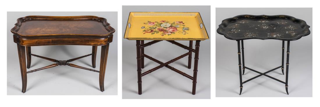 Three Tray Tables: One, a Victorian style tray table with shaped rectangular tray on slightly splayed legs joined by an X stretcher, height 24 inches, width 36 inches, depth 25 inches; another a Papier Mache tray table 