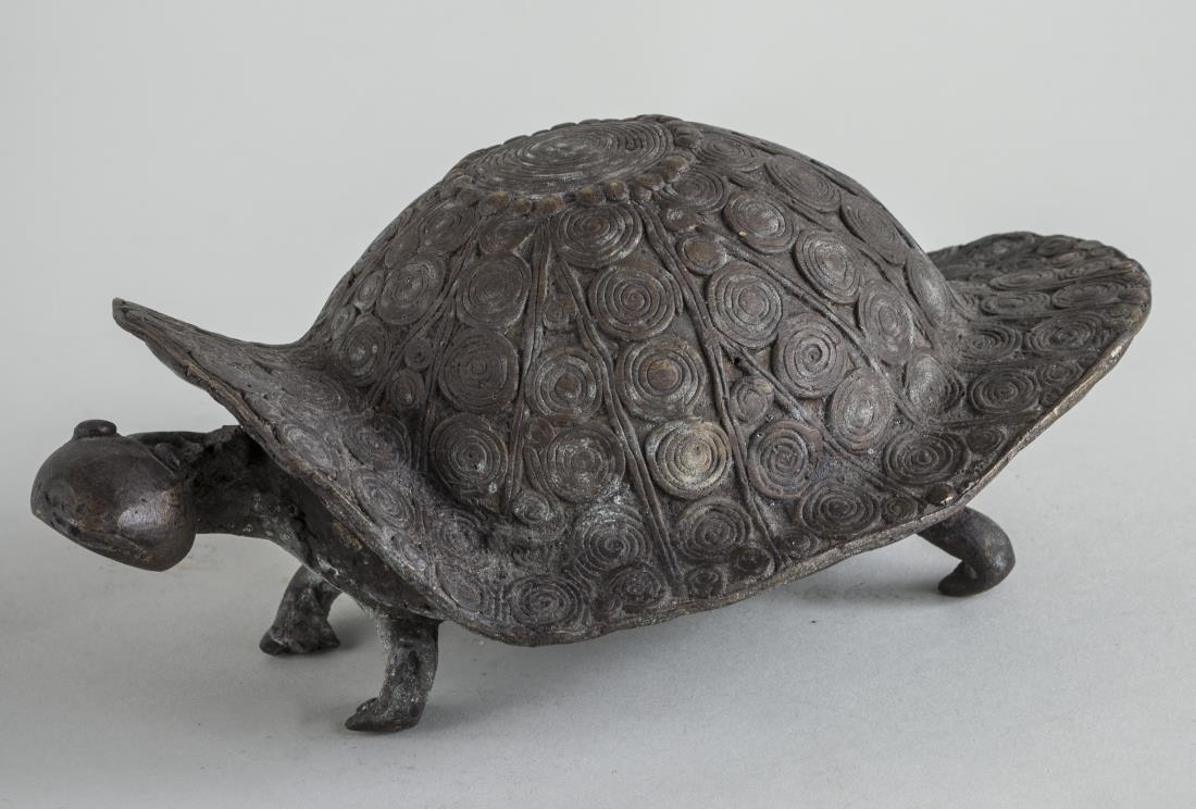 African Bronze Tortoise: Modeled standing. Height 6 inches. Notice to bidders: Condition reports and additional photographs are provided by request as a courtesy to our clients, as such any condition report is only an opinion