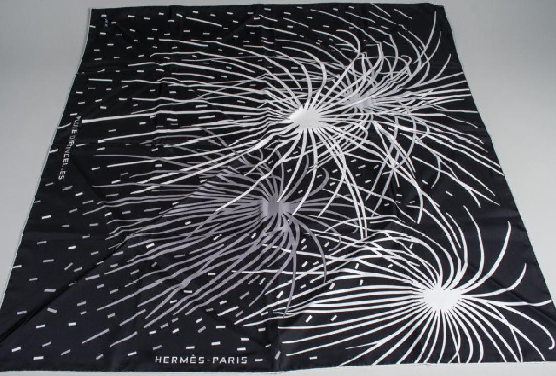Hermes Pluie D'Etincelles Silk Scarf: Designed by Wlodek Kaminski Year of First Issue: 2005, black and white. 35 x 35 inches. Notice to bidders: Condition reports and additional photographs are provided by request as a courtesy to our cli
