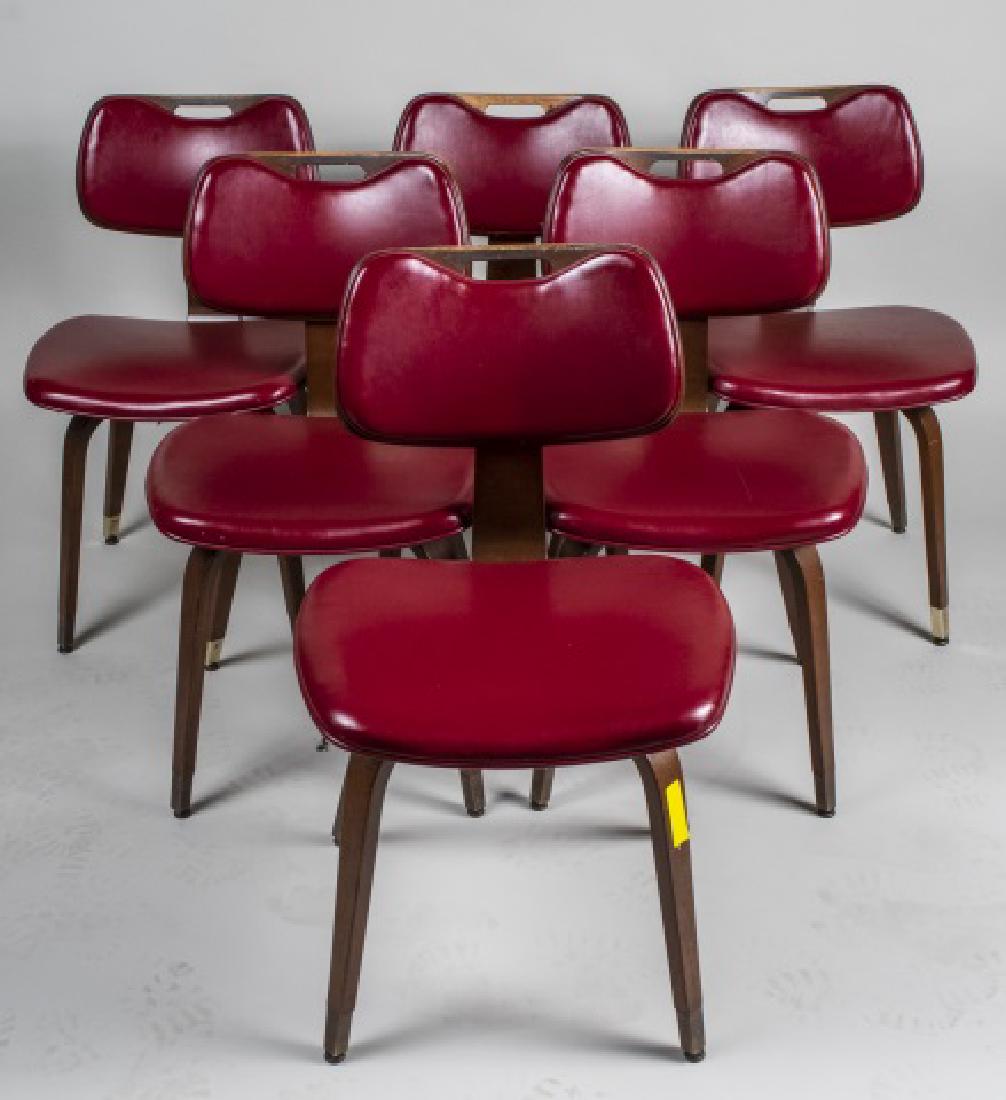 Set of Six Thonet Style Side Chairs: Each with red vinyl upholstered back and seat, on bent wood legs. Height 31 inches, width 19 inches, depth 21 inches. Notice to bidders: Condition reports and additional photographs are provided by re