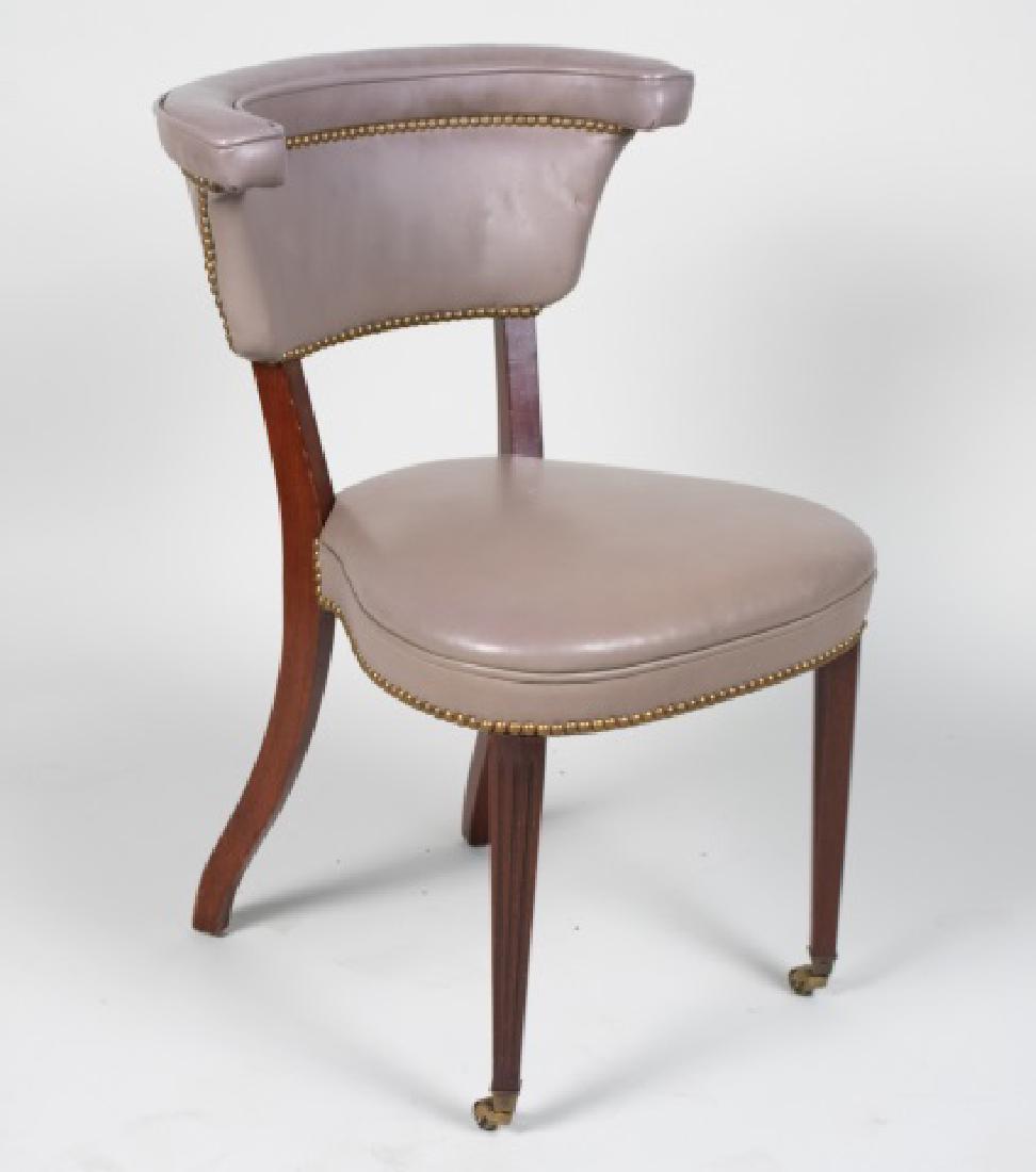 Grey Leather Side Chair: Horseshoe back side chair with splayed legs. Height 32 inches, width 22 inches, depth 22 inches. Notice to bidders: Condition reports and additional photographs are provided by request as a courtesy t