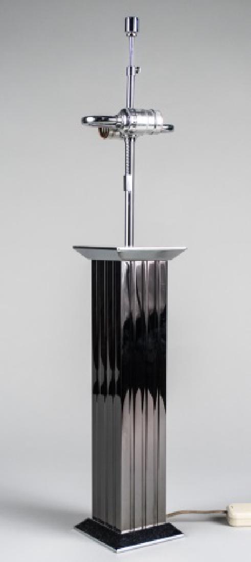 Karl Springer Stainless Steel Table Lamp: Two light square columnar lamp, signed. Base, height 16 inches. Notice to bidders: Condition reports and additional photographs are provided by request as a courtesy to our clients, as such any condit