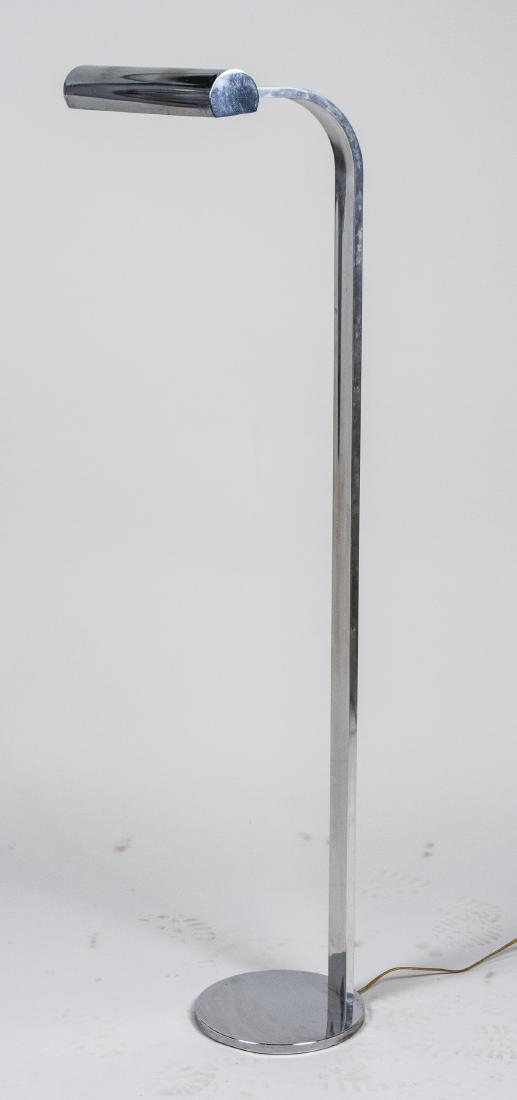 Chrome Floor Lamp: Two light lamp on a bent chrome support, circular base. Height 51 inches. Notice to bidders: Condition reports and additional photographs are provided by request as a courtesy to our clients, as such 