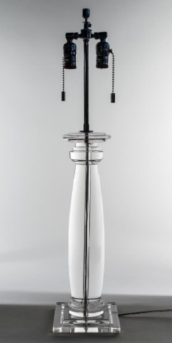 Lucite Table Lamp: Two light columnar lamp with square base. Base height 19 inches. Notice to bidders: Condition reports and additional photographs are provided by request as a courtesy to our clients, as such any condi