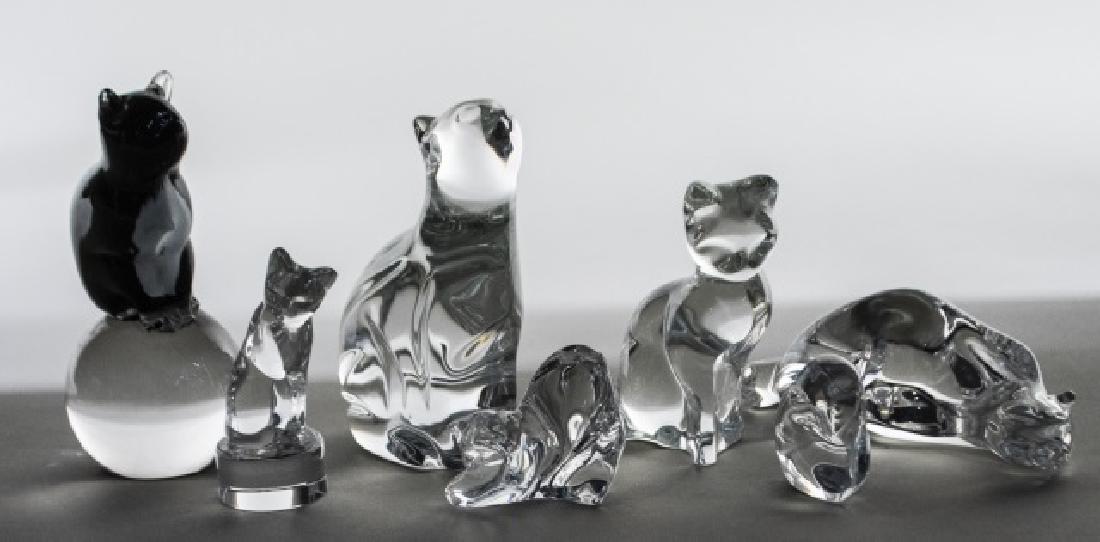 Group of Crystal Cat Figurines: Various makers and styles, including Baccarat , Hoya, Waterford, etc. Tallest, height 5 1/2 inches. Notice to bidders: Condition reports and additional photographs are provided by request as a courtes