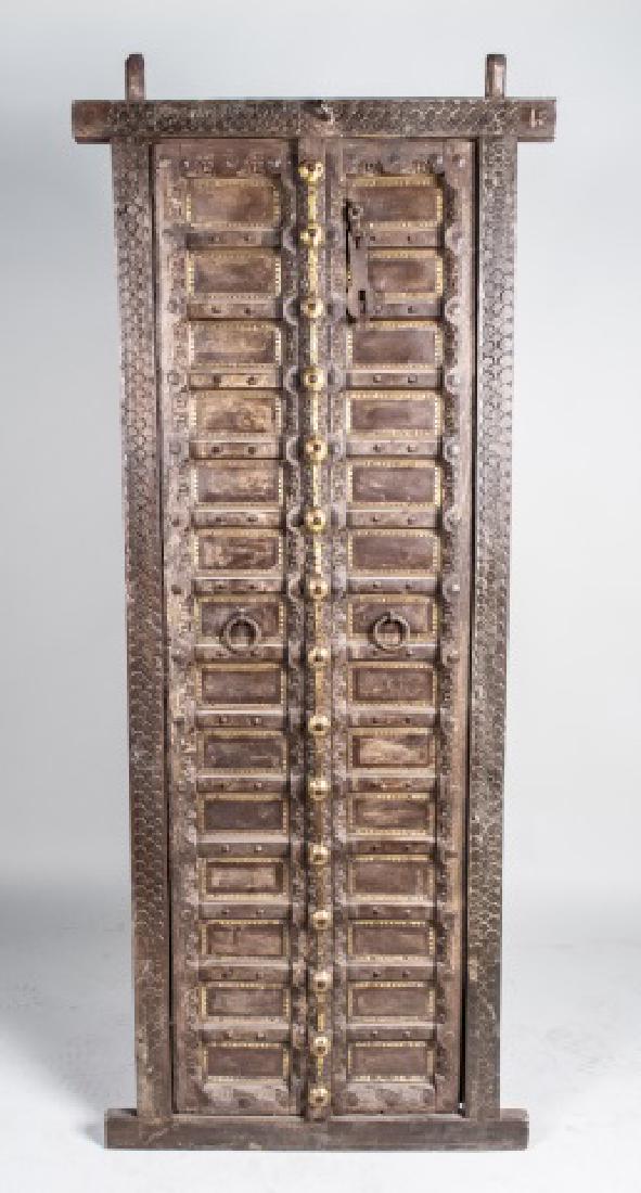 Moroccan Paneled Door / Wall Hanging: Two doors / converted to a wall decoration. Height 75 inches, width 31 inches. Notice to bidders: Condition reports and additional photographs are provided by request as a courtesy to our clients, as