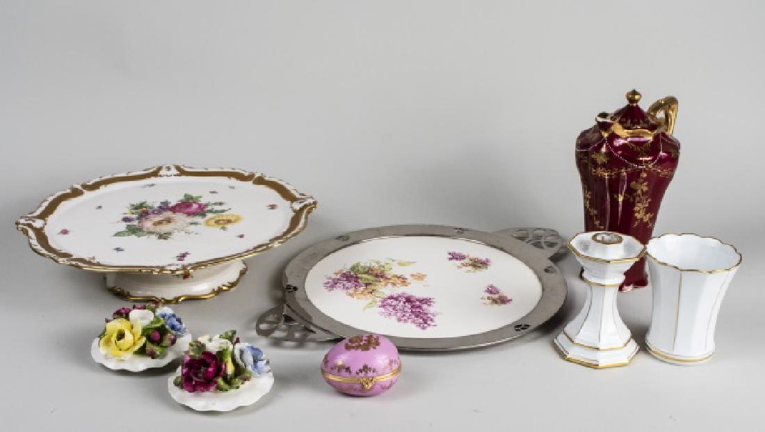 Group of Continental Porcelain Table Articles: Including a chocolate pot, a cake stand, a trinket box, a circular serving tray, etc. Chocolate pot, height 9 1/4 inches. Notice to bidders: Condition reports and additional photographs are provided b