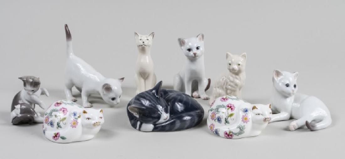 Group of Continental Porcelain Cat Figures: Various makers including Bing & Grondahl, Royal Copenhagen, Belleek, NAO, Minton, etc. Tallest, height 5 1/2 inches. Notice to bidders: Condition reports and additional photographs are provided by req