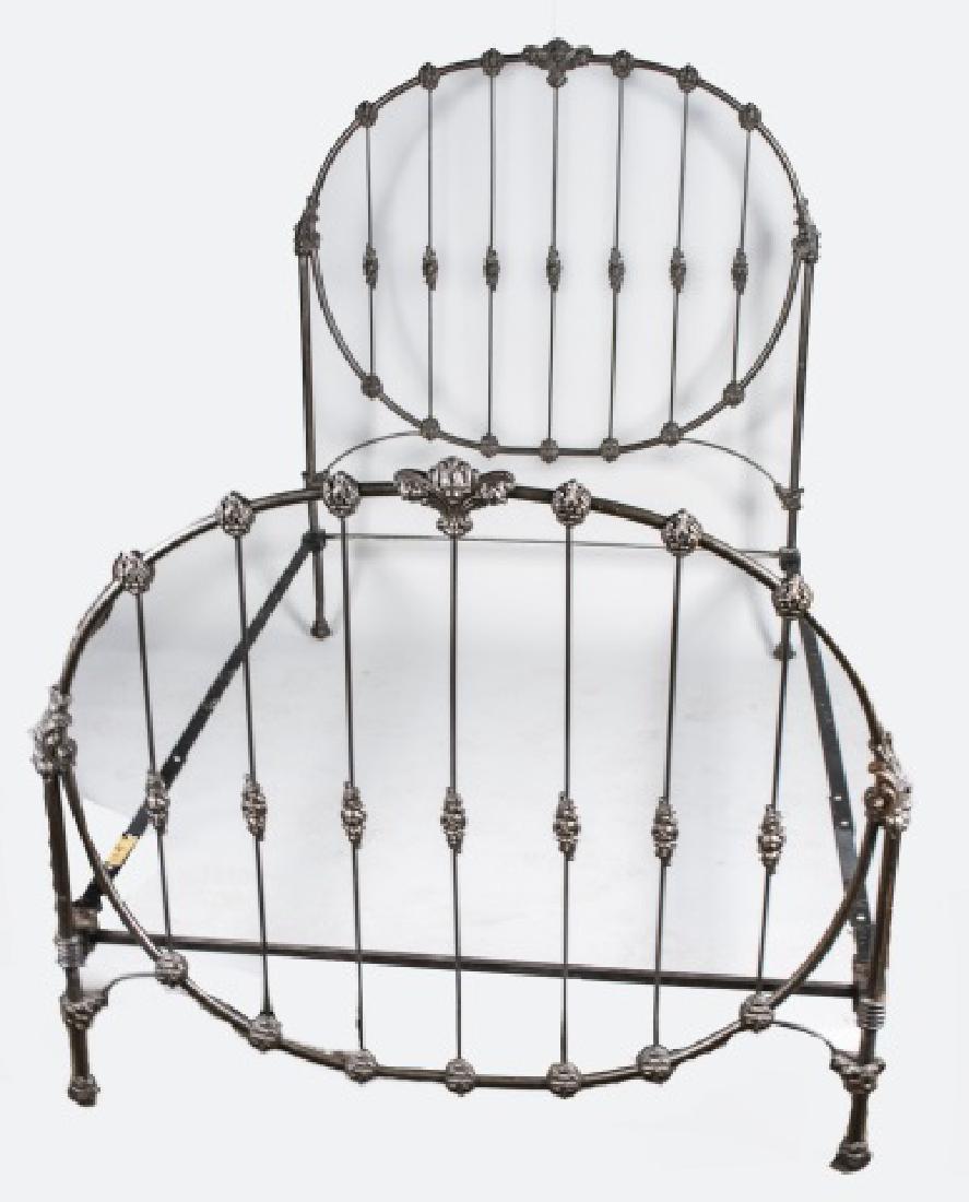 Cast Iron Bed: Headboard and footboard with rosette decoration. Headboard, 64 1/2 x 54 inches. Notice to bidders: Condition reports and additional photographs are provided by request as a courtesy to our clients, as