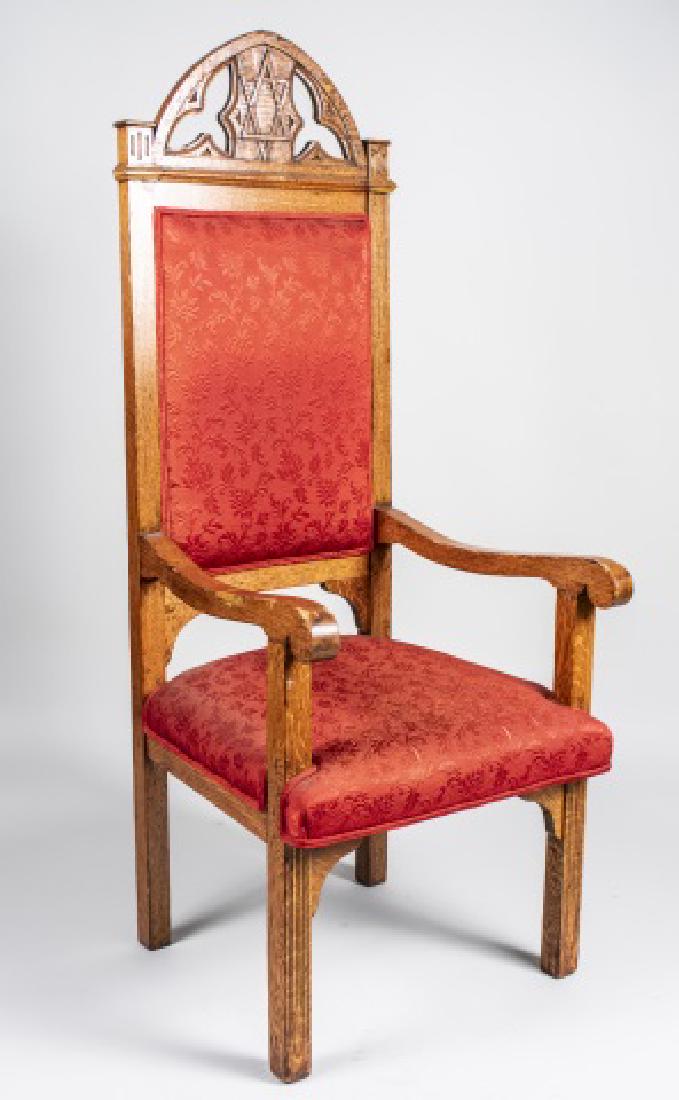 Gothic Revival Style Oak Armchair: Gothic arch top with star of David decoration, red upholstered back and seat, open arms. Height 61 inches, width 25 inches, depth 22 inches. Notice to bidders: Condition reports and additional photogr