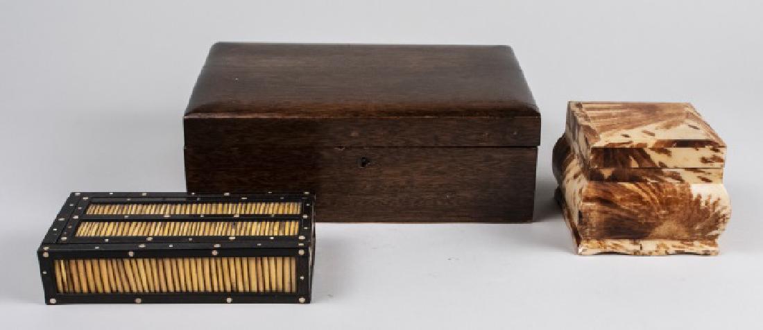 Group of Three Decorative Boxes: Including an oak box, an exotic wood box, and a porcupine quill box. Oak box, height 4 1/2 inches, width 12 inches, depth 8 inches. Notice to bidders: Condition reports and additional photographs are