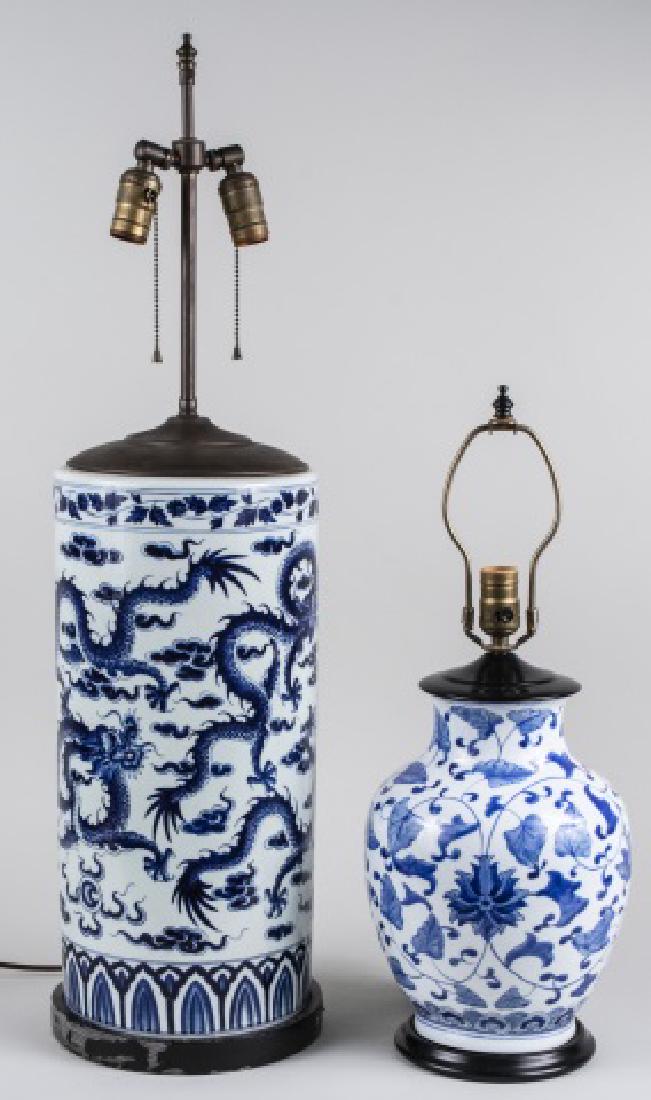 Two Decorative Blue and White Porcelain Lamps: A two light lamp with dragon decoration and a single light lamp, with stylized floral decoration. Taller, base height 18 1/2 inches. Notice to bidders: Condition reports and additional photographs are
