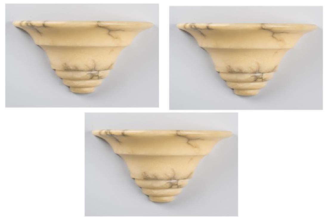 Set of Three Alabaster Shades: Grey veined cream alabaster tapered half circle shades. Height 8 1/4 inches, width 14 inches. Notice to bidders: Condition reports and additional photographs are provided by request as a courtesy to o