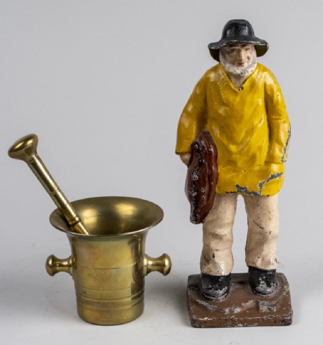 Figural Door Stop and Brass Mortar and Pestle: Including a polychrome painted door stop depicting a fisherman, and a brass mortar and pestle of typical form. Door stop, height 11 inches. Notice to bidders: Condition reports and additional photogra