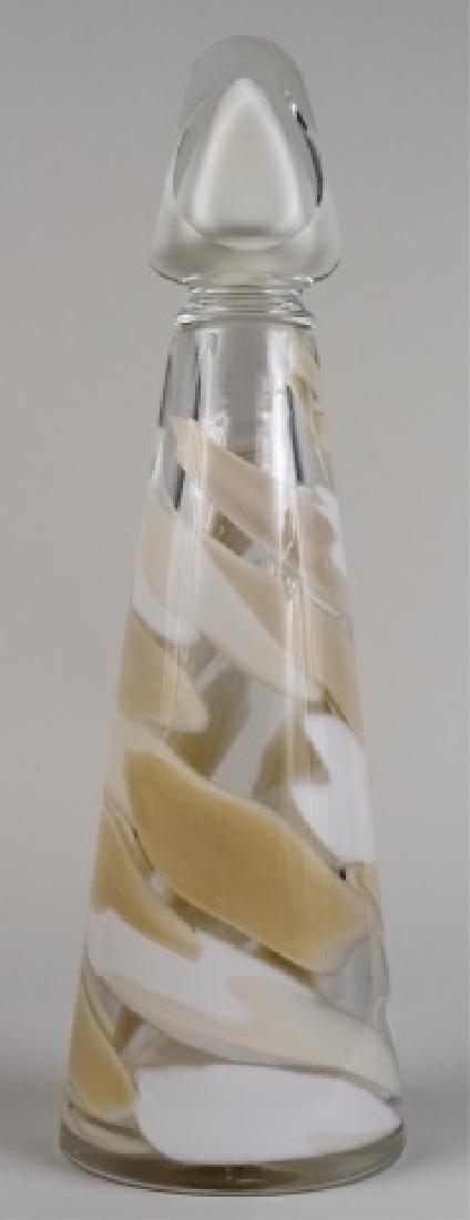 Abby Modell Hand-Blown Art Glass Decanter *: Cream swirl decoration Height 16 inches Notice to bidders: Condition reports and additional photographs are provided by request as a courtesy to our clients, as such any condition report is only an op