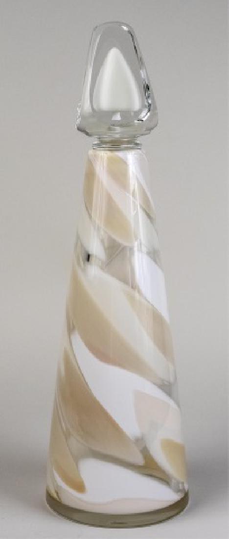 Abby Modell Hand-Blown Art Glass Decanter *: Cream swirl decoration Height 16 inches Notice to bidders: Condition reports and additional photographs are provided by request as a courtesy to our clients, as such any condition report is only an op