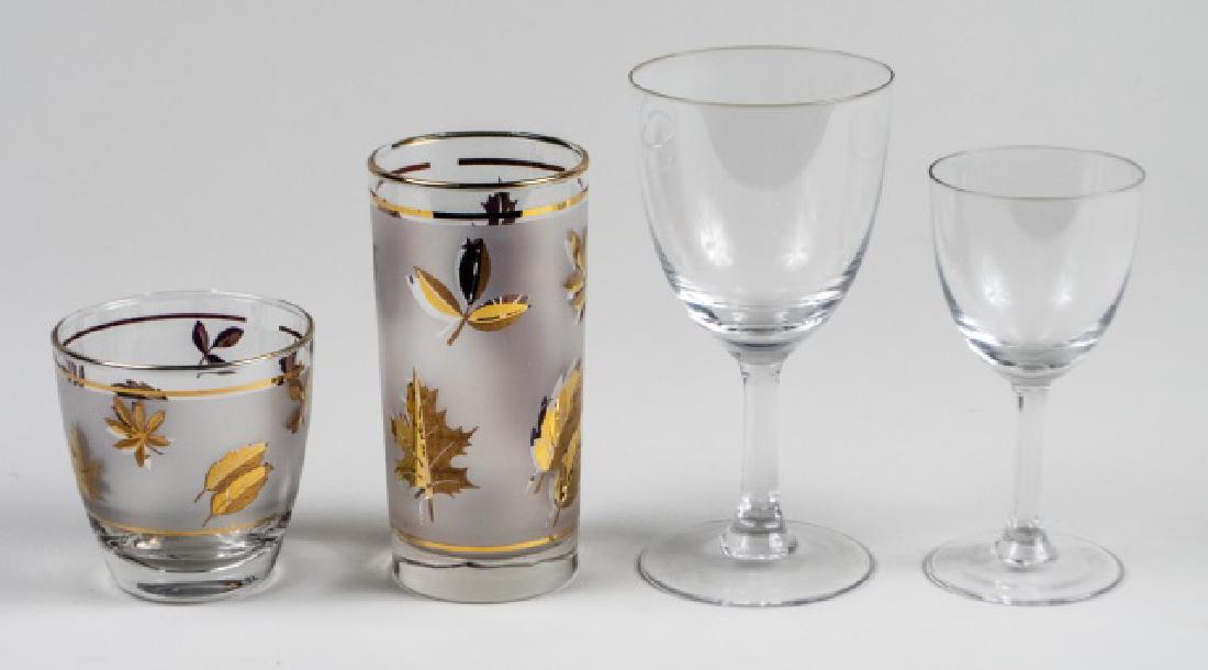 Group of Glassware: Approximately thirty eight pieces, including seven old fashioned glasses and eight highball glasses with gilt leaf decoration, and twelve goblets and twelve wine glasses in clear glass, various makers
