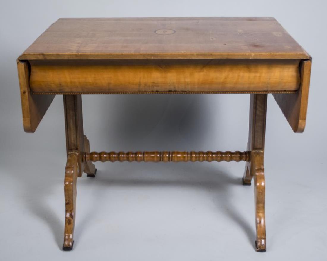 Continental Inlaid Sofa Table: Rectangular top with inlaid patera, flanked by side drop leaves, over an ogee molded drawer, trestle base Unextended, height 31 inches, width 37 inches, depth 26 inches Notice to bidders: Condition re