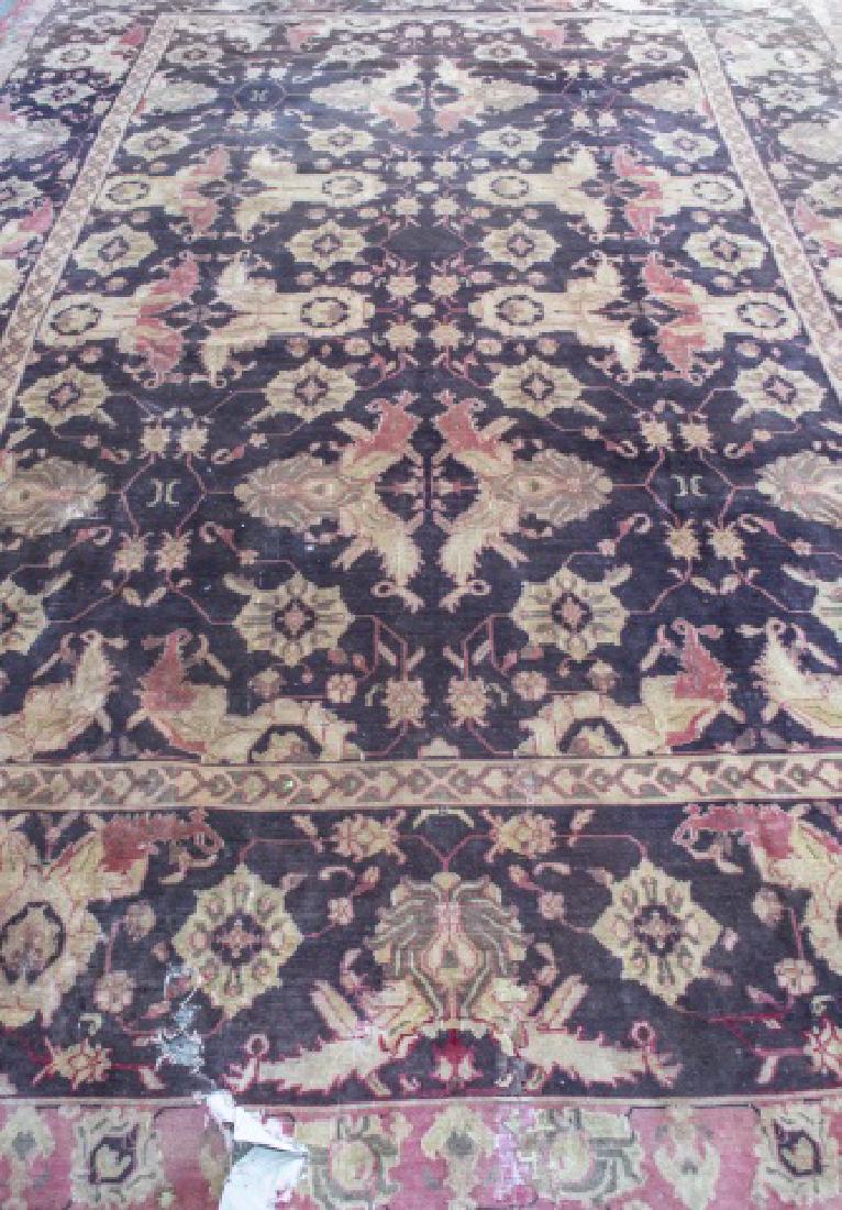Antique Agra Carpet: North India, circa 1900, allover stylized floral decoration on a brown field, within a rose, brown and tan border with similar floral decoration (As is) 15 feet x 13 feet 3 inches Notice to bidders: C