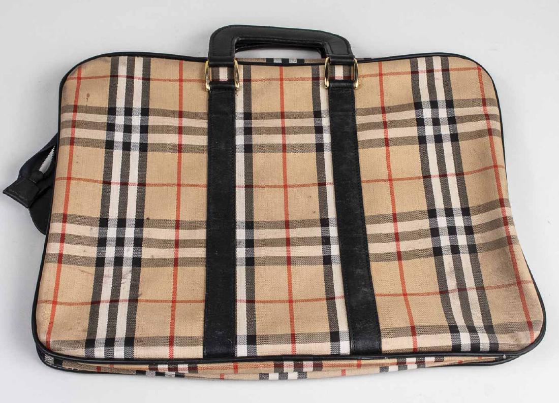 Burberry Bag: Burberry print fabric Approximately 12 1/2 x 17 inches Notice to bidders: Condition reports and additional photographs are provided by request as a courtesy to our clients, as such any condition repor