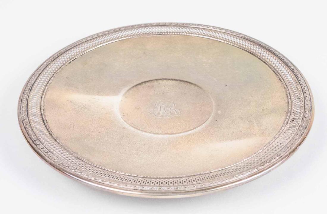 Gorham Sterling Silver Cake Plate: Circular with pierced border. Diameter 10 inches, 350 grams. Provenance: From the Estate of Robert Sauers of New York and Philadelphia. Notice to bidders: Condition reports and additional photographs 