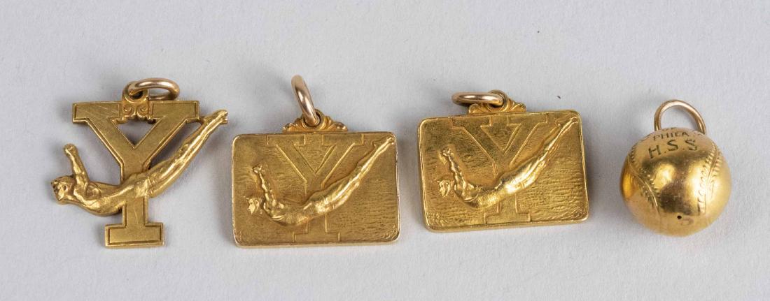 Four Gold Pendant Charms: 14k yellow gold, two for Intercollegiate Champions, 1923 and 1925, a World Championship Record Relays and a 1920 Basketball charm. Total 23 grams. Provenance: From the Estate of Robert Sauers of New Y
