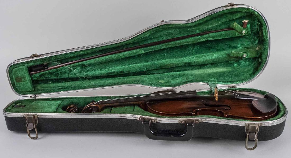 German Violin: One piece back, paper label inside reads "Johann George Lippold musikalischer Neukirchen bey Adorf " and dated 1807, with bow and case. Back length 14 3/4 inches (375 mm). Notice to bidders: Condition