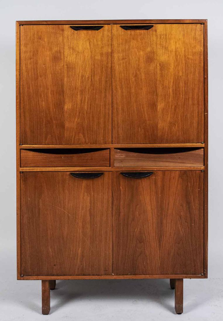 Jens Risom Hutch: Two door cabinet above drawers and another cabinet, Jens Risom label in door. Height 56 inches, width 36 inches, depth 12 3/4 inches. Notice to bidders: Condition reports and additional photographs ar