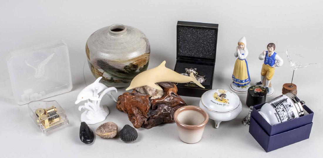 Group of Table Decorations: Including dolphin figures, pottery vase, porcelain trinket box, piano music player, egg coddler, etc. Various sizes. Notice to bidders: Condition reports and additional photographs are provided by req