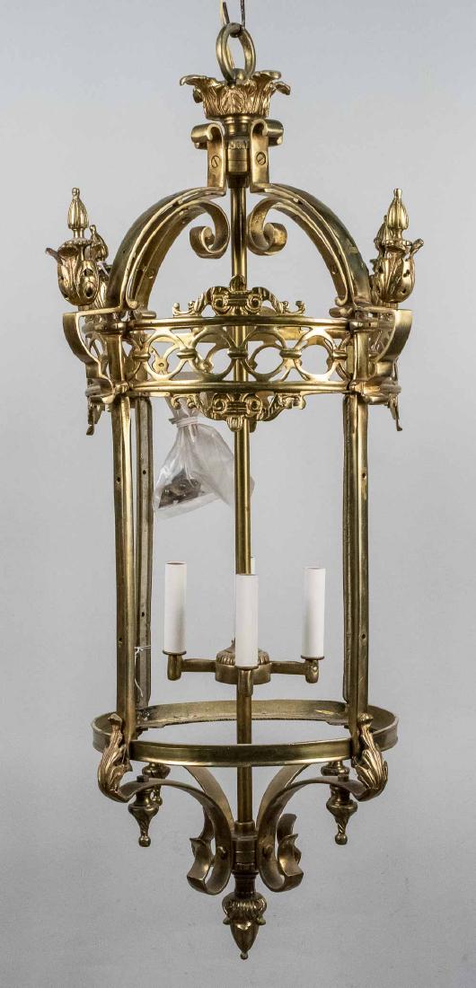 Gothic Revival Style Hanging Lantern: Four lights. Height 36 inches, width 14 inches. Notice to bidders: Condition reports and additional photographs are provided by request as a courtesy to our clients, as such any condition report is on