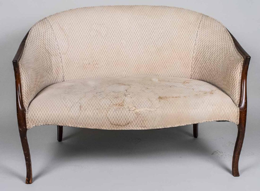 Chippendale Style Settee: Off white colored upholstered back and seat, slightly scrolled legs. Height 34 inches, width 48 inches, depth 30 inches. Notice to bidders: Condition reports and additional photographs are provided by