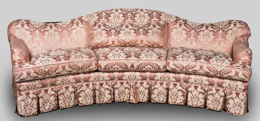 Randall Tysinger for EJ Victor Sofa: Pink floral embroidered upholstery, slightly curved sofa with serpentine crest down scrolled arms, three cushion seat, and pleated skirt. Height 37 inches, width 115 inches, depth 47 inches. Notice to