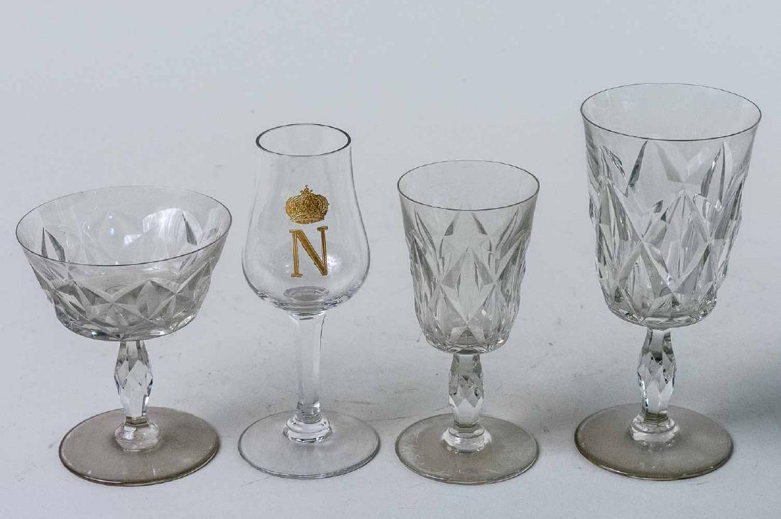 Baccarat Stemware Set: Approximate twenty eight pieces, Choiseul pattern, comprising twelve champagne/sherbet glasses, eleven wine glasses, and five claret wine glasses; together with three sherry glasses with gilt Napoleon